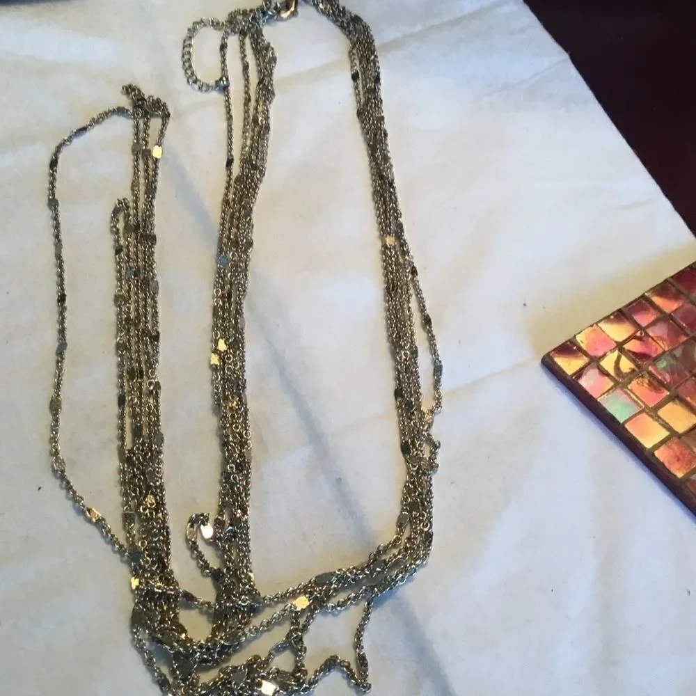 $12 or 3/$25. 5 Strand Goldtone Necklace